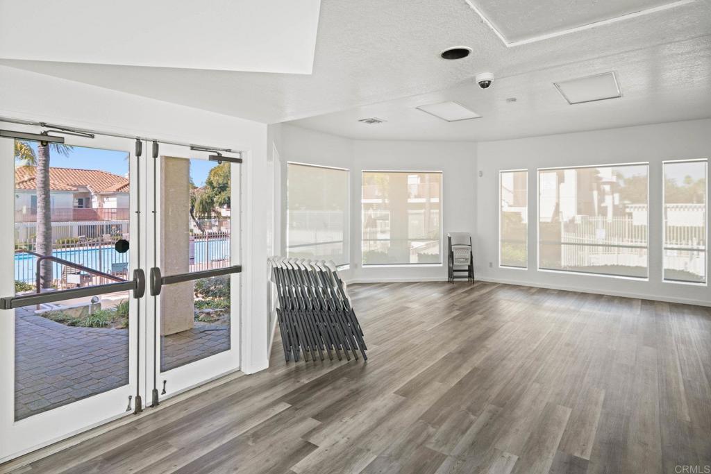 430 Stoney Point Way, Unit 129 Oceanside, CA 92058 - Photo 32 of 40 a view of a livingroom with wooden floor and furniture