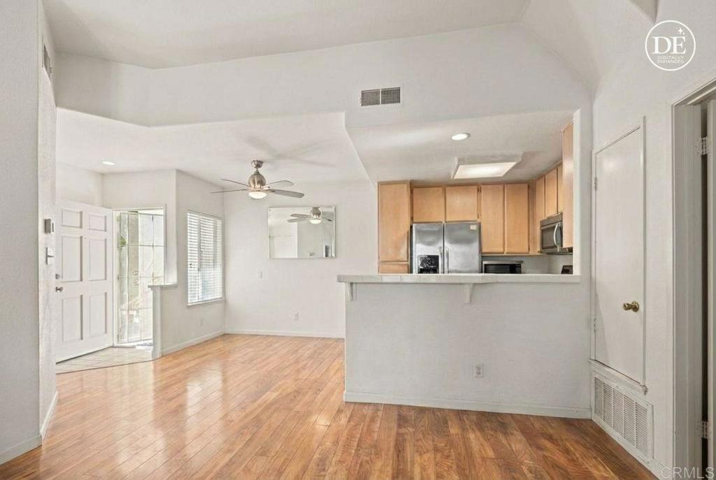 430 Stoney Point Way, Unit 129 Oceanside, CA 92058 - Photo 40 of 40 a kitchen with stainless steel appliances a refrigerator and a stove top oven
