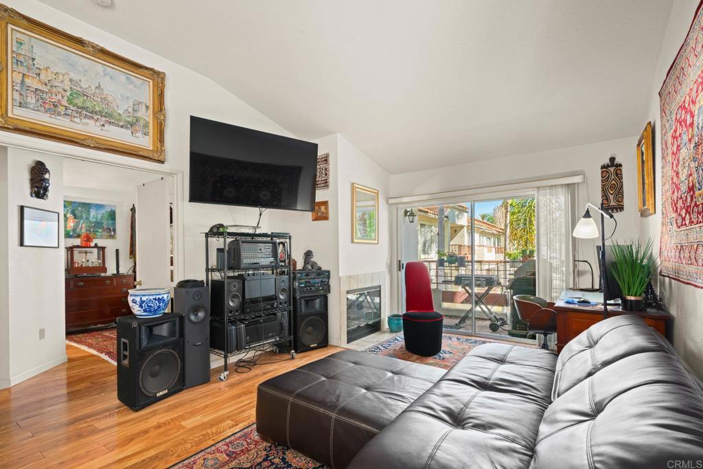 430 Stoney Point Way, Unit 129 Oceanside, CA 92058 - Photo 6 of 38 a living room with furniture and a flat screen tv