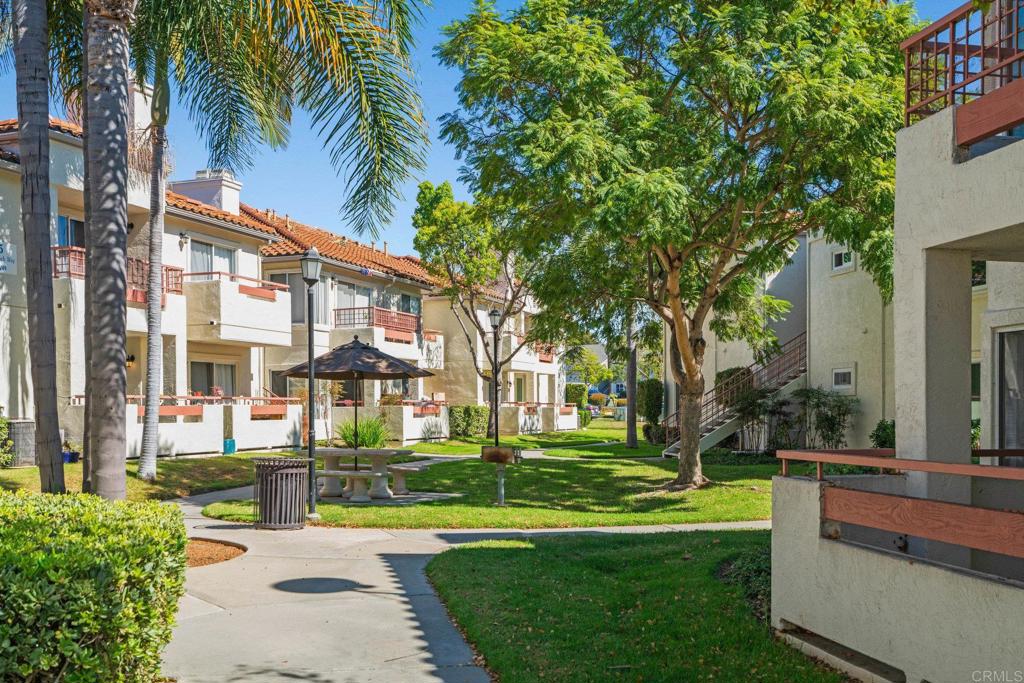 430 Stoney Point Way, Unit 129 Oceanside, CA 92058 - Photo 8 of 40 a view of a building with a yard