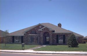 6603 Rally Road Amarillo, TX 79119 - Photo 1 of 1 a front view of a house with a garden