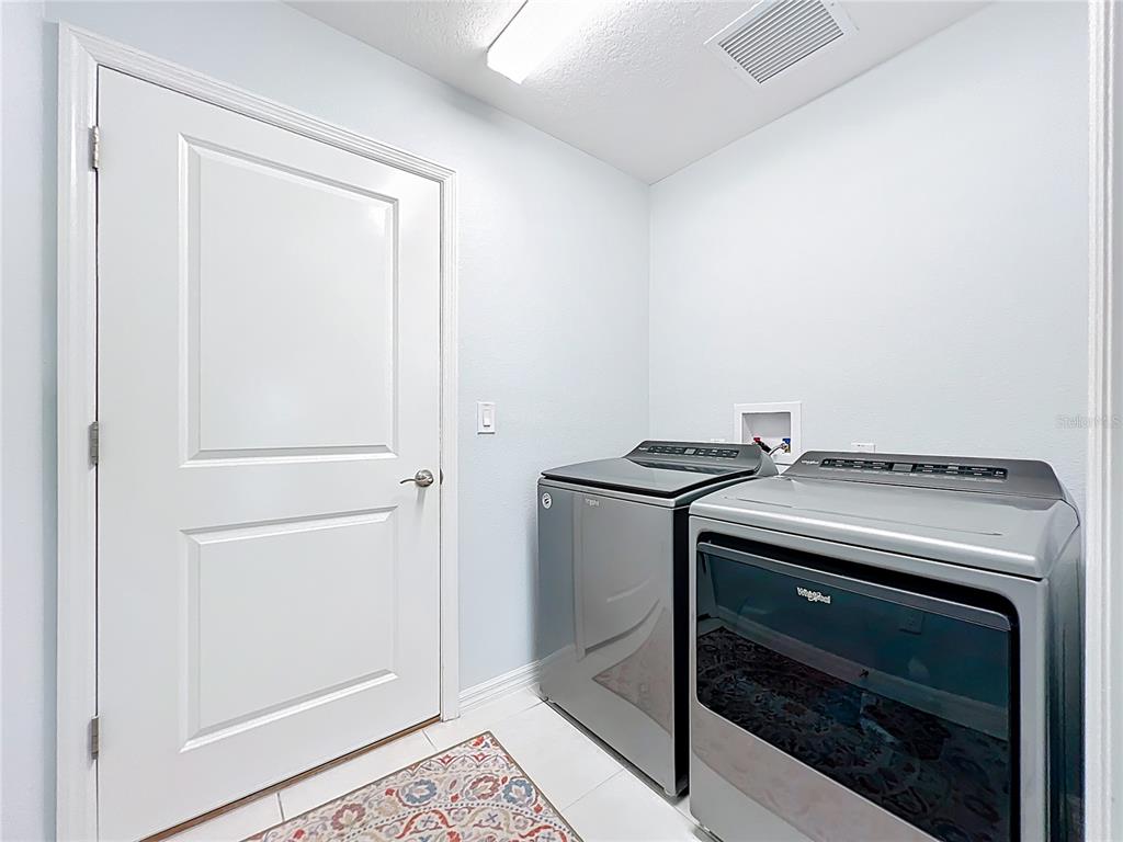 6370 Danielson Loop The Villages, FL 32163 - Photo 35 of 55 a utility room with washer and dryer