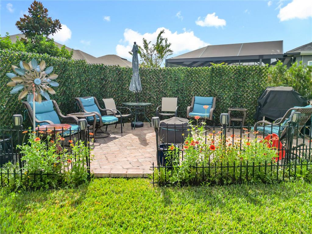 6370 Danielson Loop The Villages, FL 32163 - Photo 46 of 55 a view of a chairs and table in the garden