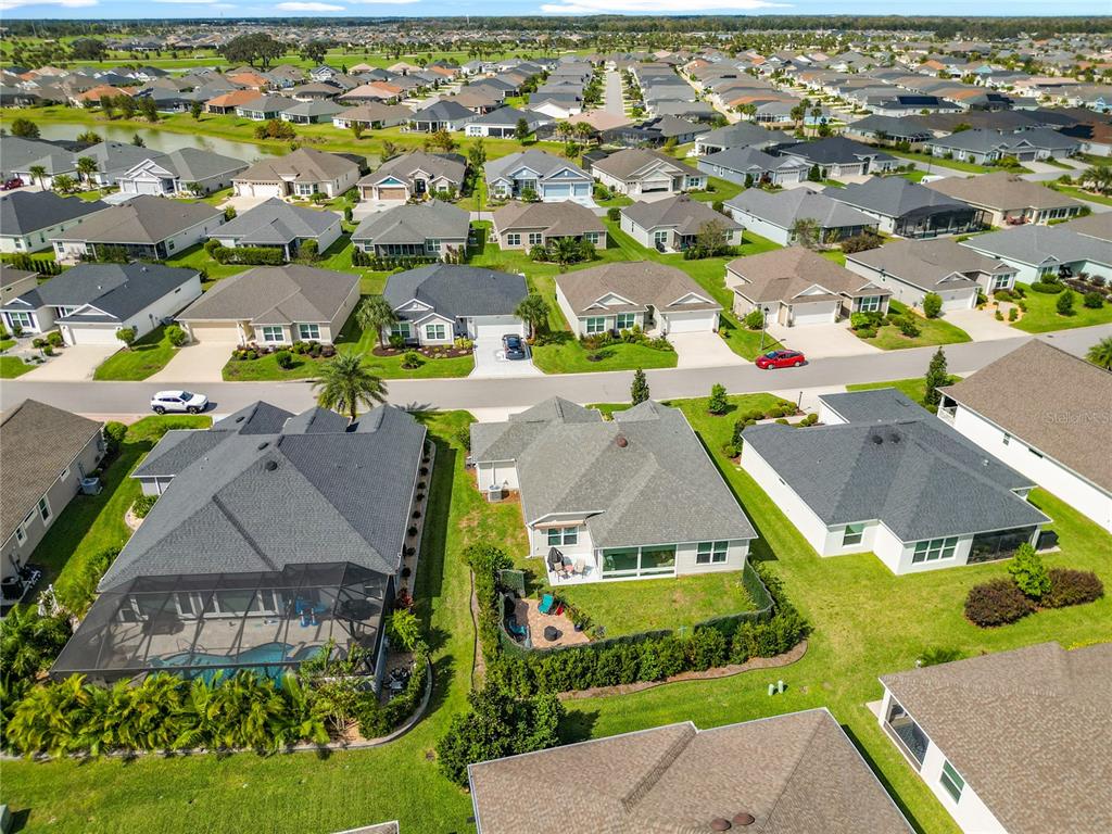 6370 Danielson Loop The Villages, FL 32163 - Photo 51 of 55 an aerial view of multiple houses with yard