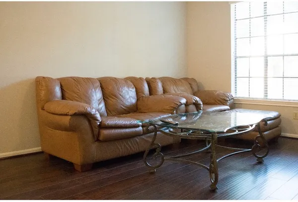 a living room with a couch and a table