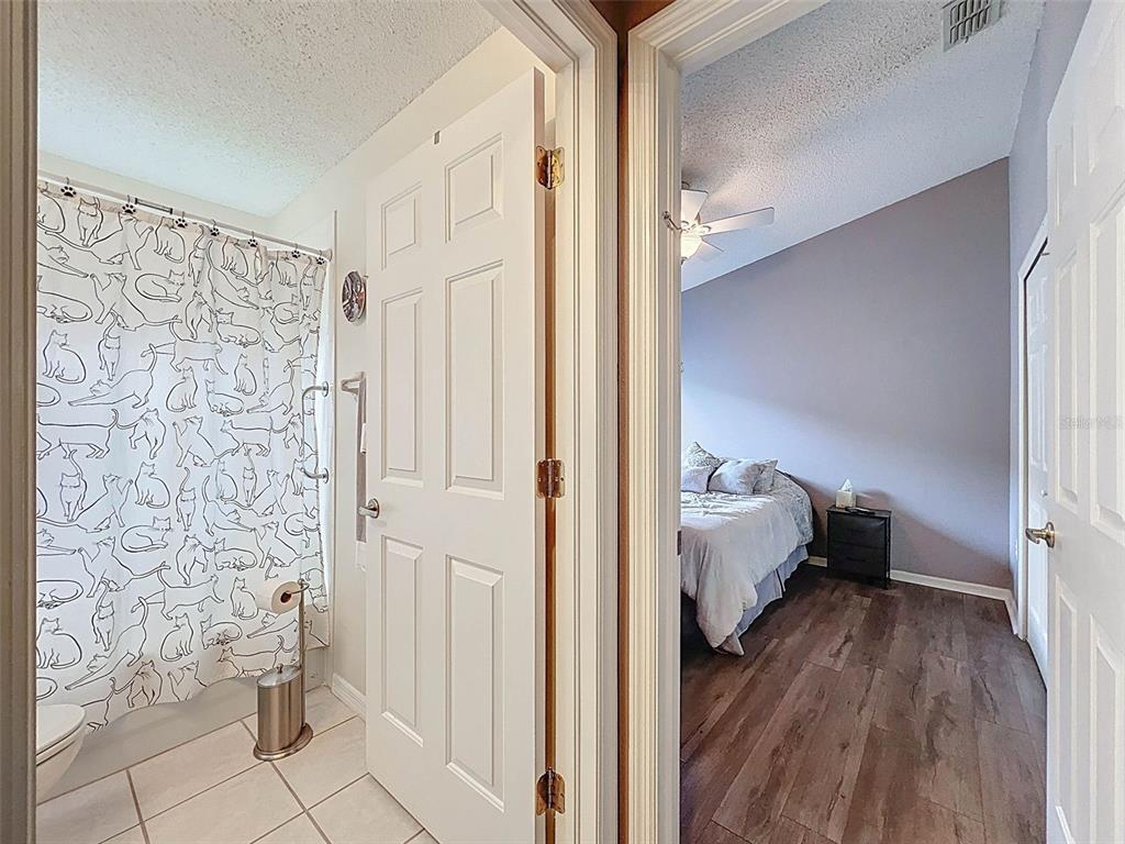189 Center Oak Circle Spring Hill, FL 34609 - Photo 45 of 61 a view of bedroom with wooden floor and furniture