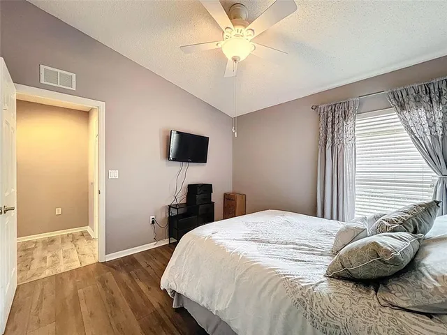 an aerial view of multiple houses with yard