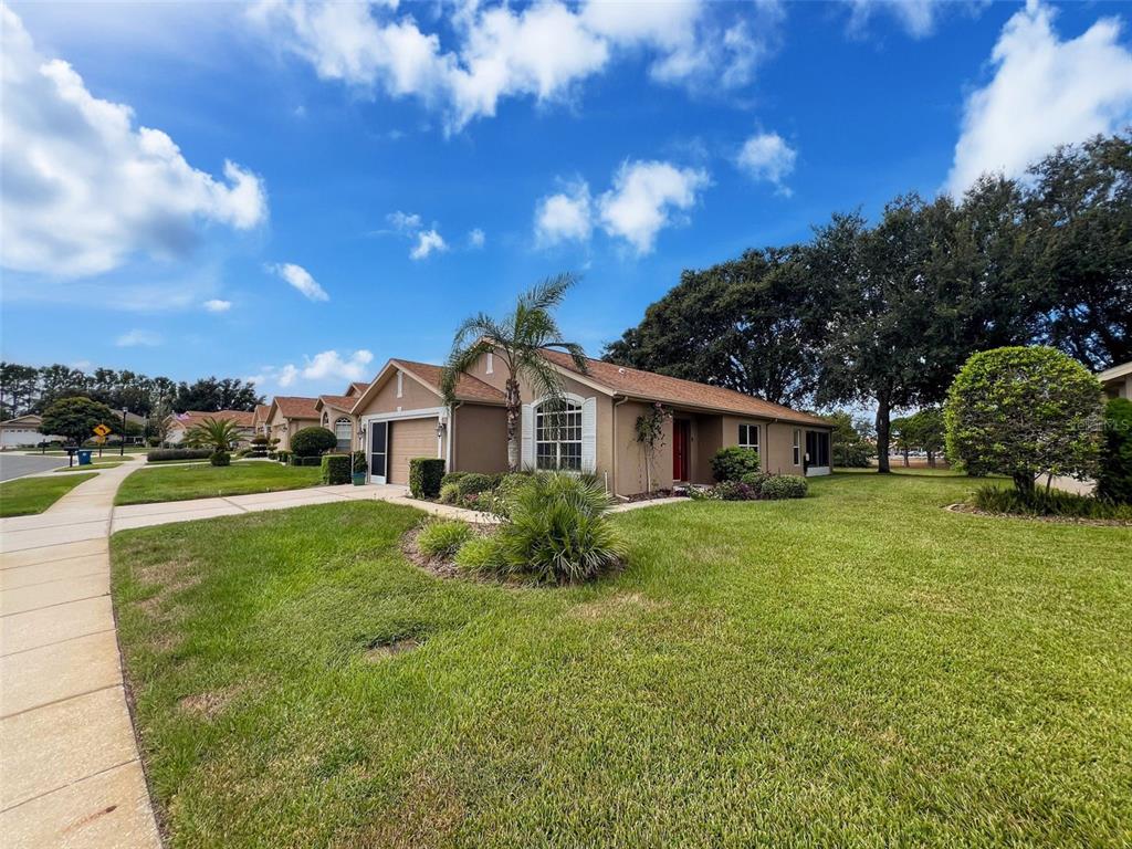 189 Center Oak Circle Spring Hill, FL 34609 - Photo 55 of 61 a front view of a house with garden