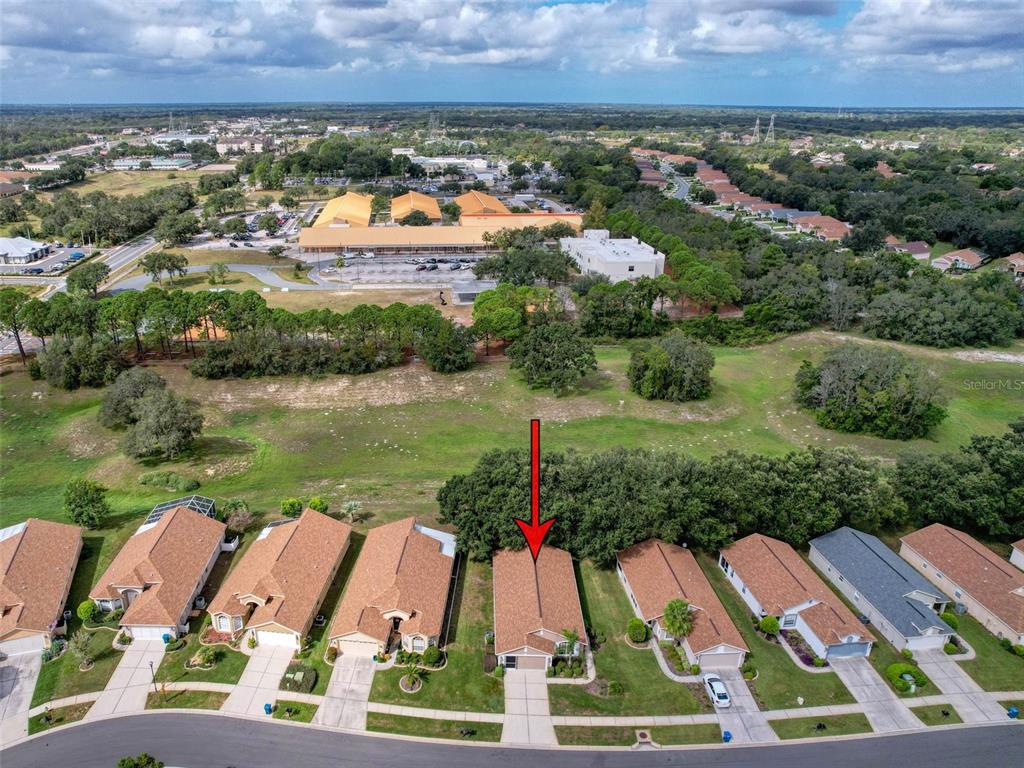 189 Center Oak Circle Spring Hill, FL 34609 - Photo 56 of 61 an aerial view of residential houses with outdoor space and lake view