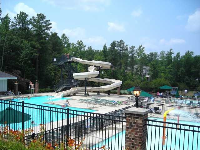 4905 Gable Ridge Lane Holly Springs, NC 27540 - Photo 24 of 25 Use of all three pools, 2 in Sunset Ridge & 1 in Sunset Oaks, including the Aquatic Center with waterslide, is included with a Sunset Ridge Raquet and Swim Club Membership. Aquatic Center