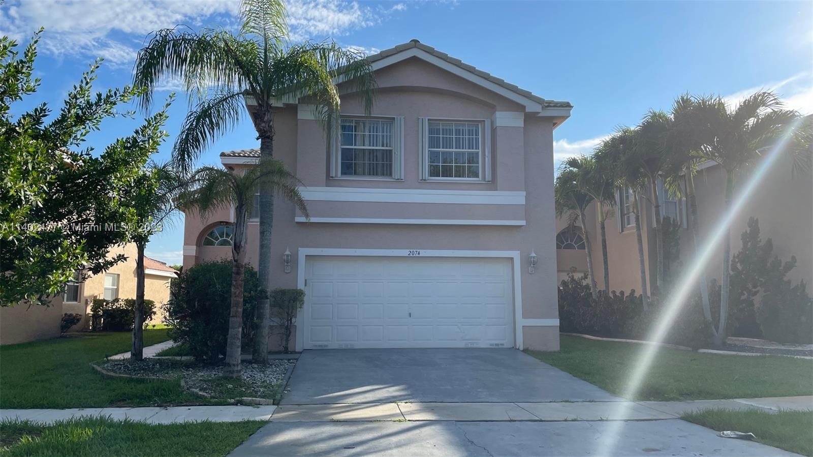 Silver Lakes Miramar, FL 33029 - Photo 1 of 14 a front view of a house with garden