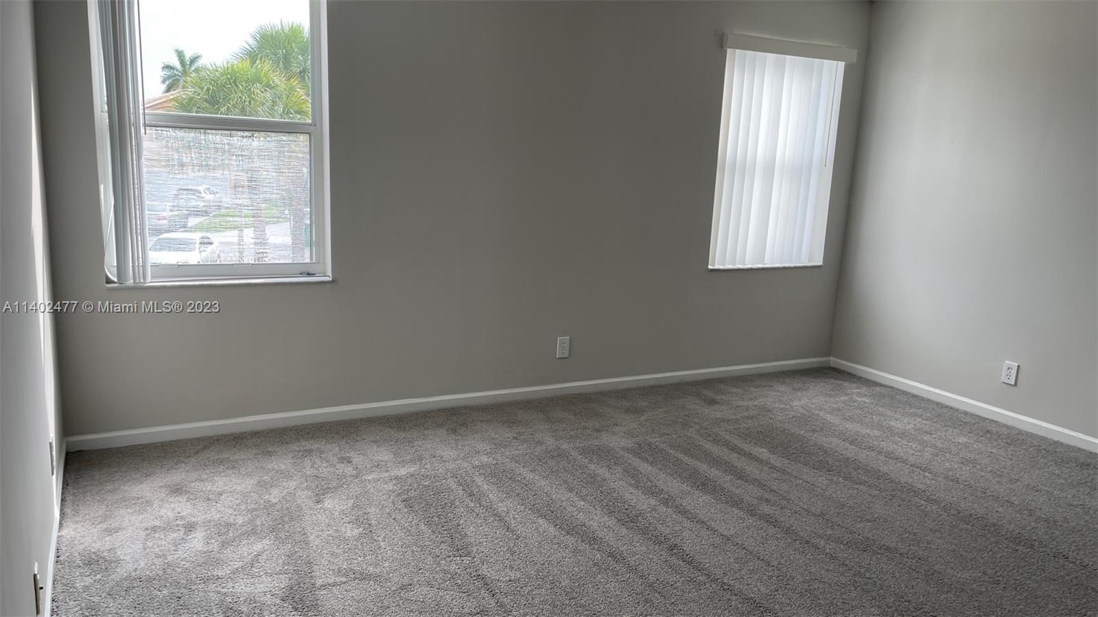 Silver Lakes Miramar, FL 33029 - Photo 11 of 14 an empty room with a window