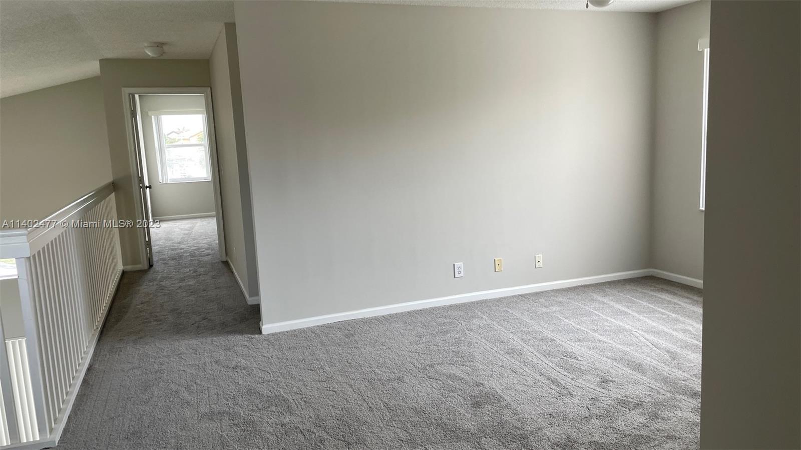 Silver Lakes Miramar, FL 33029 - Photo 12 of 14 a view of a hallway with wooden floor