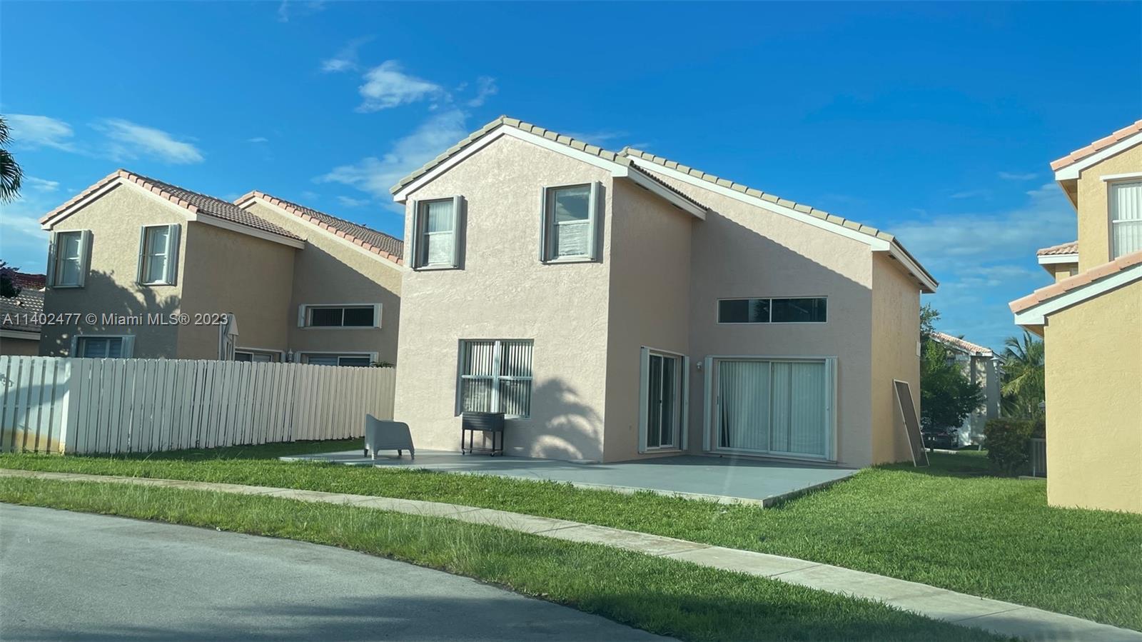 Silver Lakes Miramar, FL 33029 - Photo 3 of 14 a front view of a house with a yard