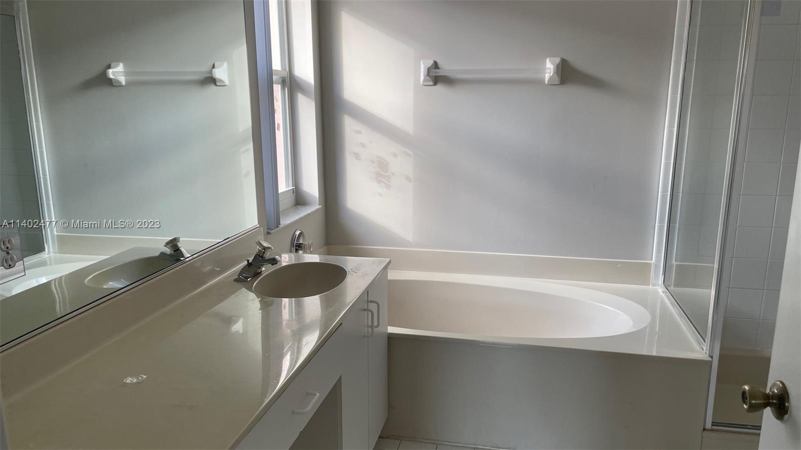 Silver Lakes Miramar, FL 33029 - Photo 10 of 14 a bathroom with a granite countertop sink and a mirror