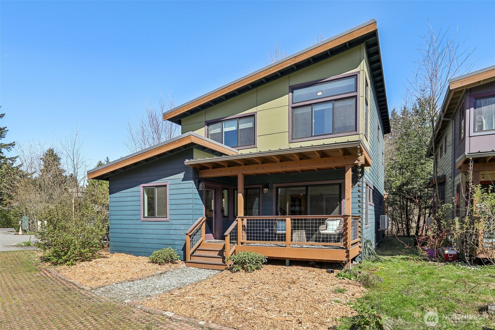 1402 194th Street Southeast, Unit 9 Bothell, WA 98012 - Photo 4 of 40 a view of a house with backyard porch and sitting area