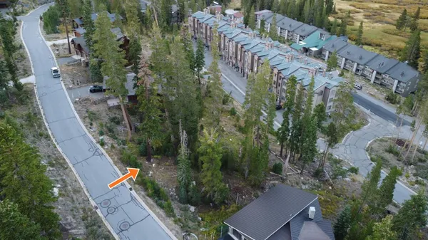 an aerial view of houses with outdoor space