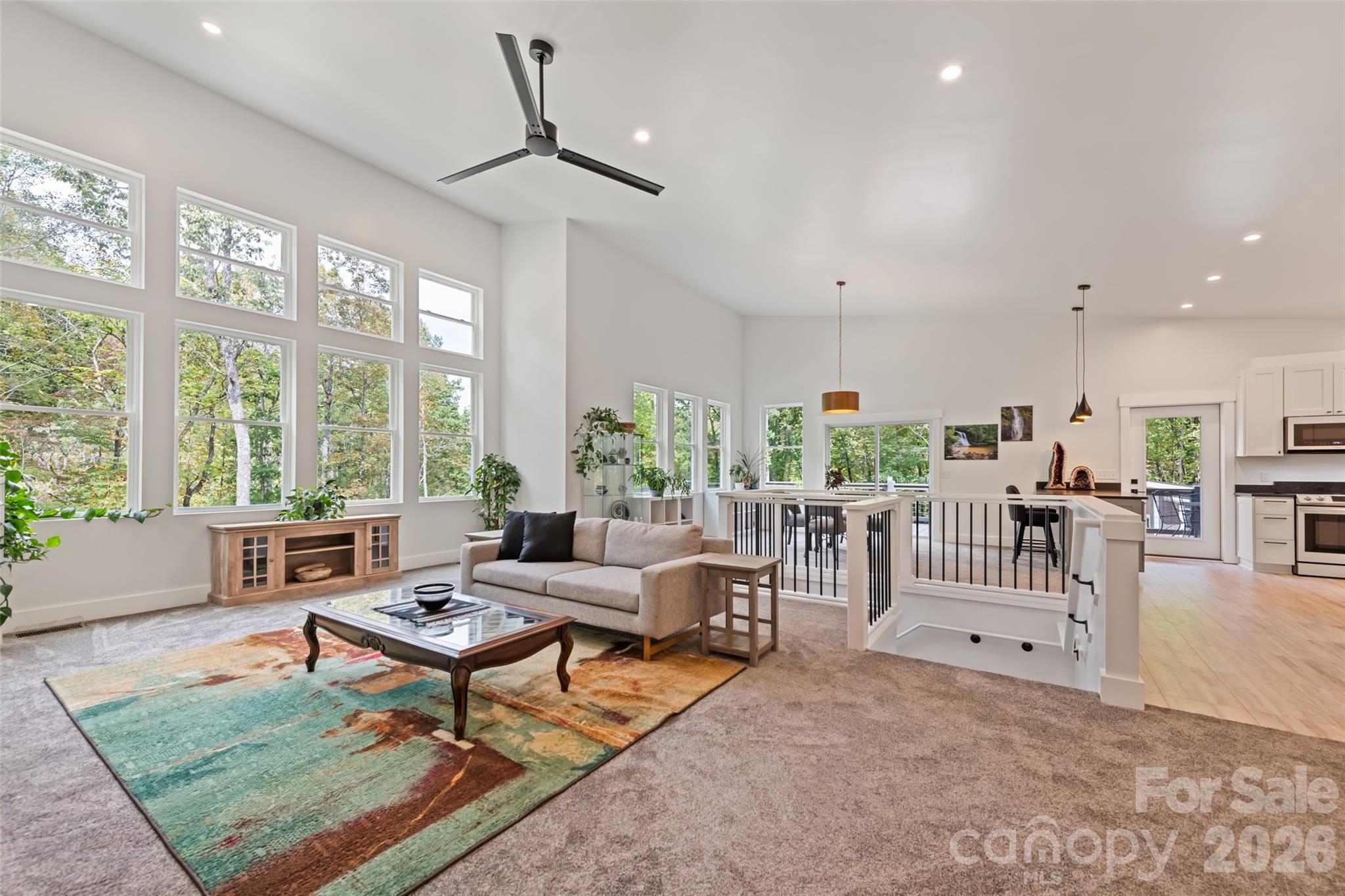 1185 Wallalieu Road Otto, NC 28763 - Photo 11 of 43 a living room with furniture and a large window