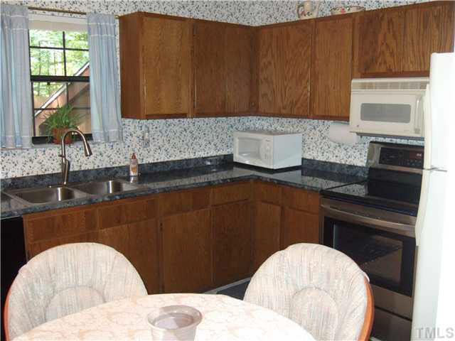 561 Willie Gray Road Timberlake, NC 27583 - Photo 5 of 23 Kitchen with breakfast area.