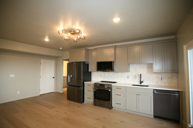 635 East Mountain Road North Ogden, UT 84414 - Photo 20 of 33 Modern kitchen featuring light gray cabinetry, white countertops, stainless steel appliances, and wood-finish flooring
