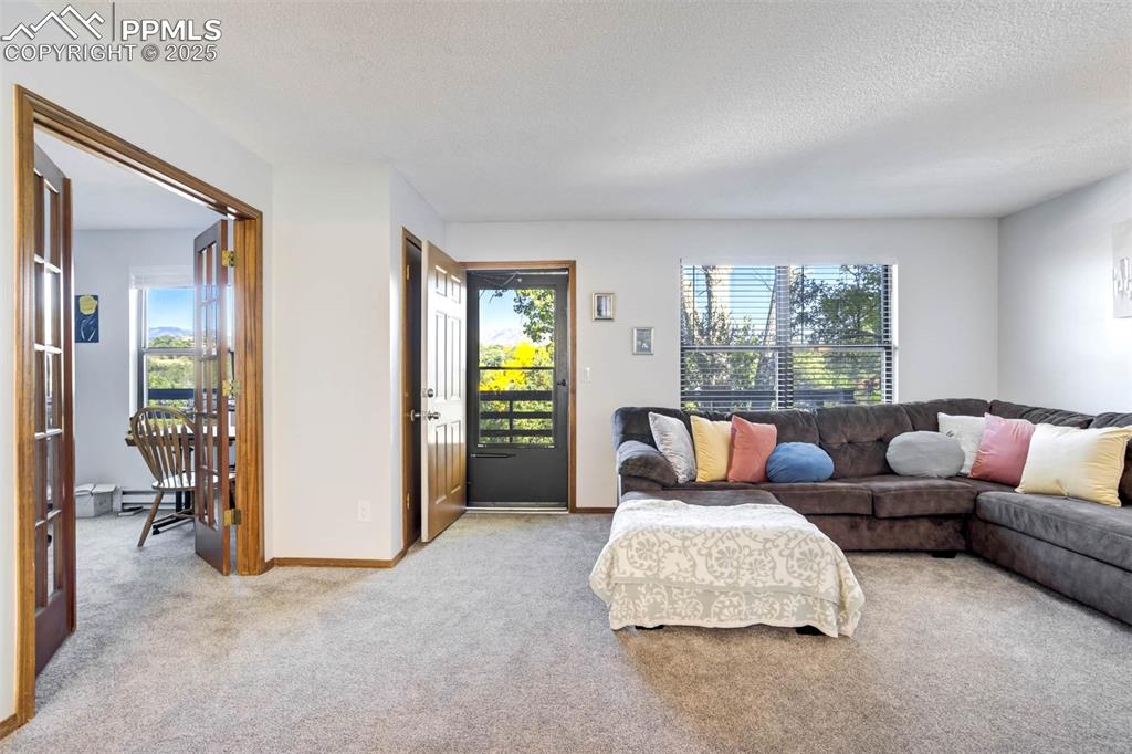 2387 Stepping Stones Way Colorado Springs, CO 80904 - Photo 12 of 35 a living room with furniture and a window