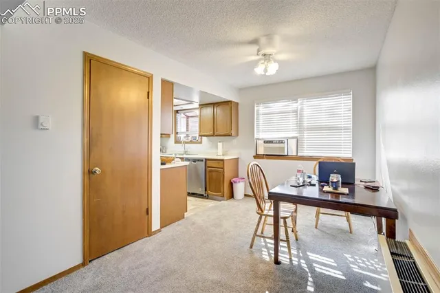 a dining room with furniture and window