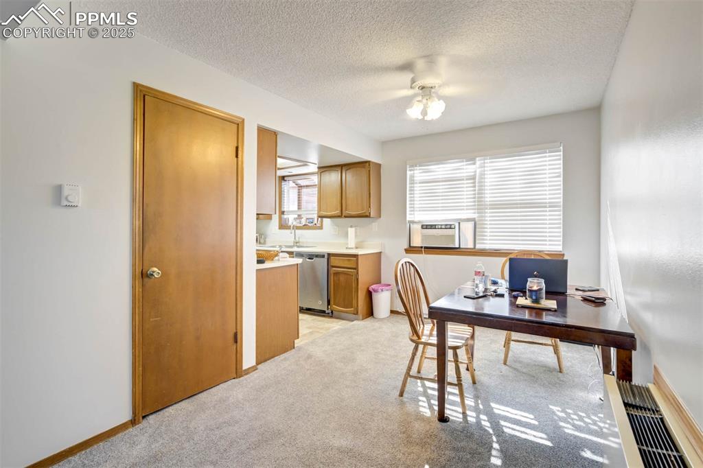 2387 Stepping Stones Way Colorado Springs, CO 80904 - Photo 14 of 35 a dining room with furniture and window