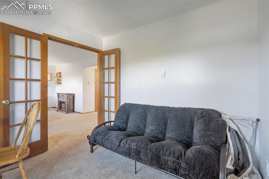 2387 Stepping Stones Way Colorado Springs, CO 80904 - Photo 23 of 35 a living room with furniture and a window