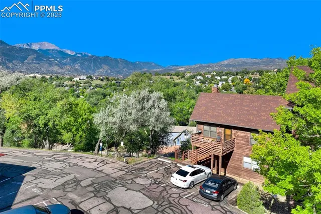 a view of a patio with chair and tables