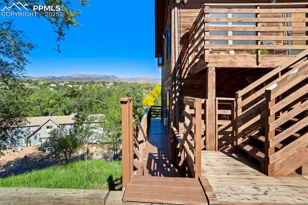 2387 Stepping Stones Way Colorado Springs, CO 80904 - Photo 6 of 35 a view of a building with trees