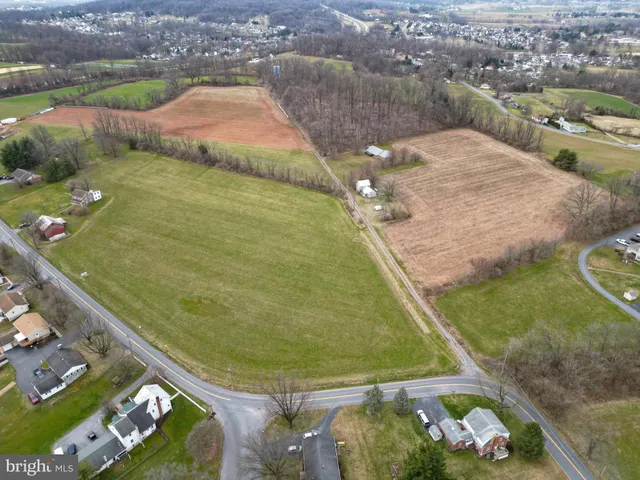 an aerial view of a house with outdoor space