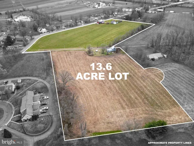 a view of a swimming pool with a yard