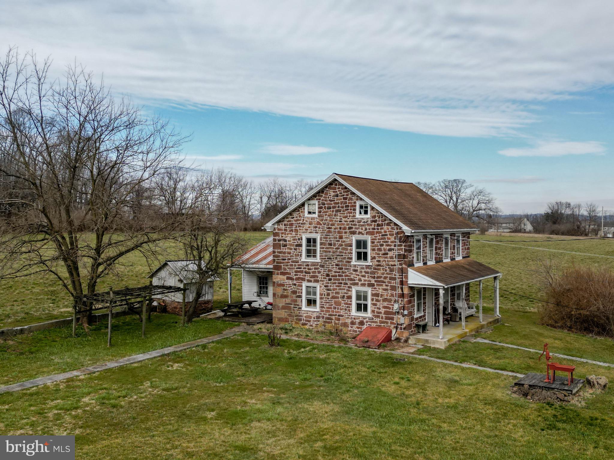 2101 Kramer Mill Road Stevens, PA 17578 - Photo 6 of 24 a aerial view of a house next to a big yard with plants and large trees