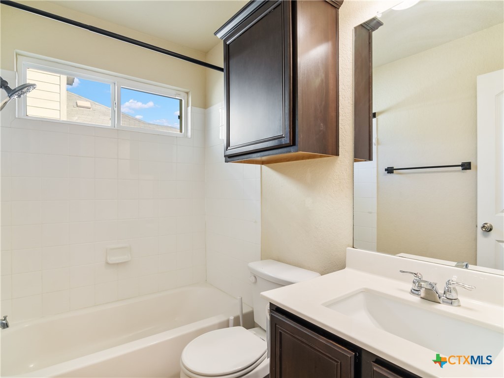 2231 Westover Loop New Braunfels, TX 78130 - Photo 11 of 35 a bathroom with a sink toilet and shower