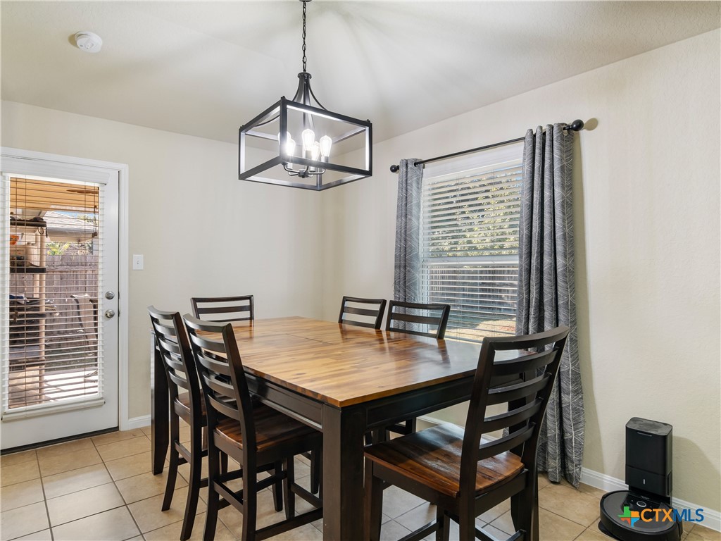 2231 Westover Loop New Braunfels, TX 78130 - Photo 16 of 35 a view of a dining room with furniture window and outside view