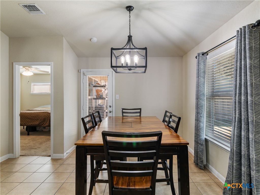 2231 Westover Loop New Braunfels, TX 78130 - Photo 19 of 36 a view of a dining room with furniture and window