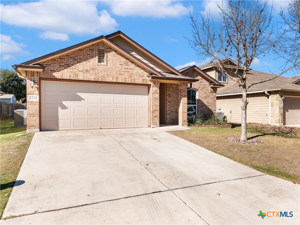2231 Westover Loop New Braunfels, TX 78130 - Photo 2 of 36 a front view of a house with a garage