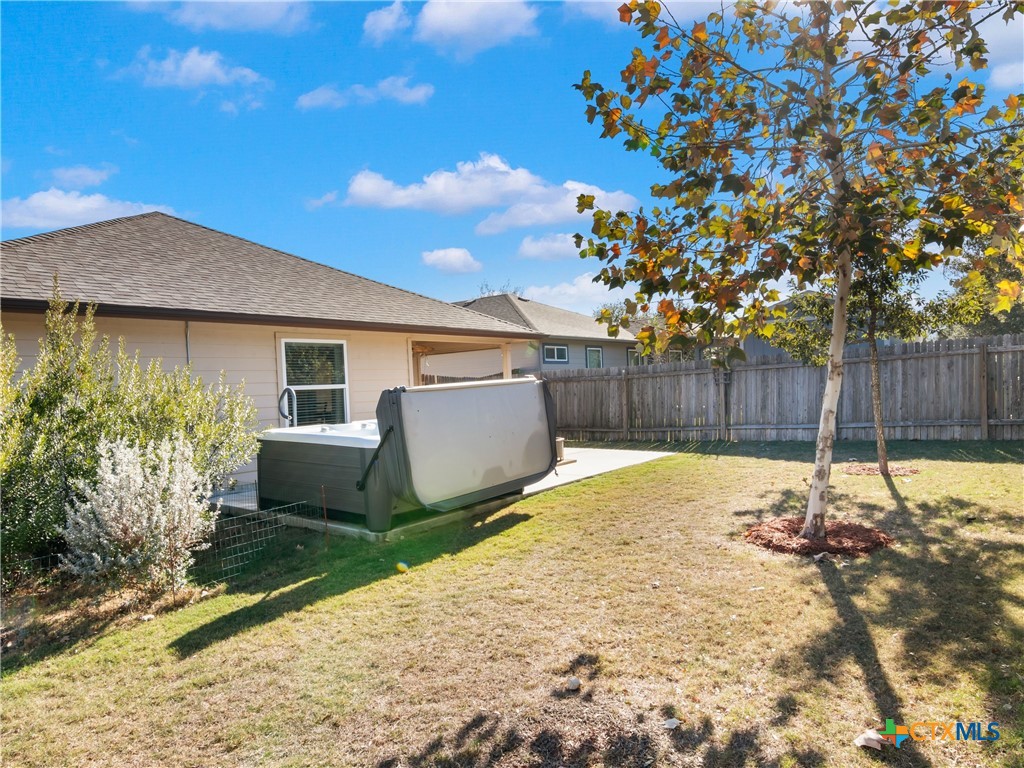 2231 Westover Loop New Braunfels, TX 78130 - Photo 24 of 35 a backyard of a house with table and chairs