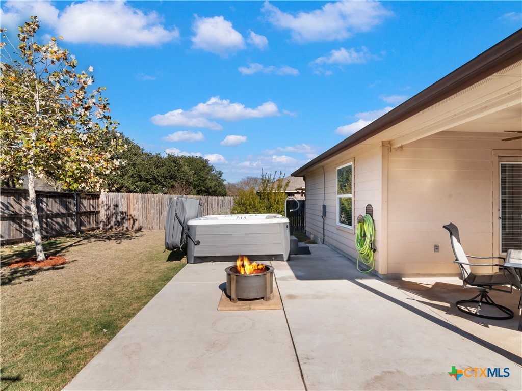 2231 Westover Loop New Braunfels, TX 78130 - Photo 28 of 36 a view of a patio with a table and chairs and potted plants
