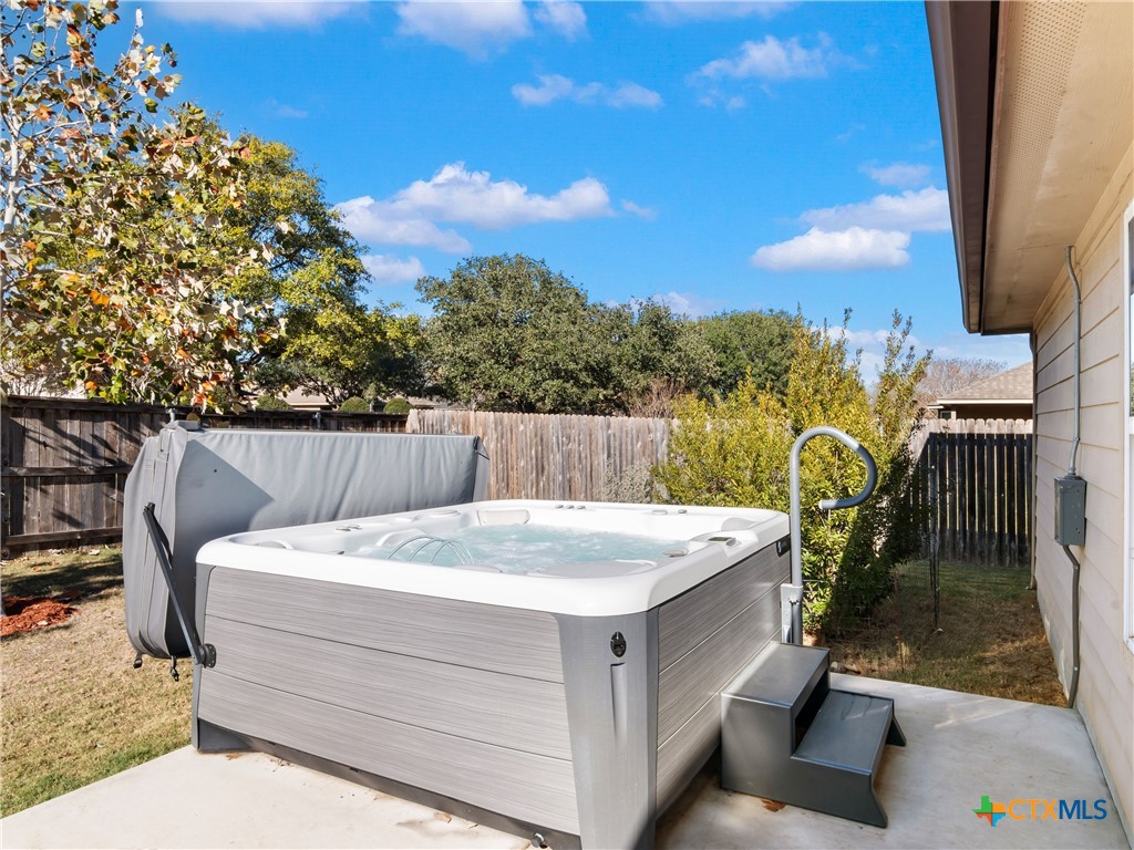 2231 Westover Loop New Braunfels, TX 78130 - Photo 30 of 36 a view of a patio with a table and chairs