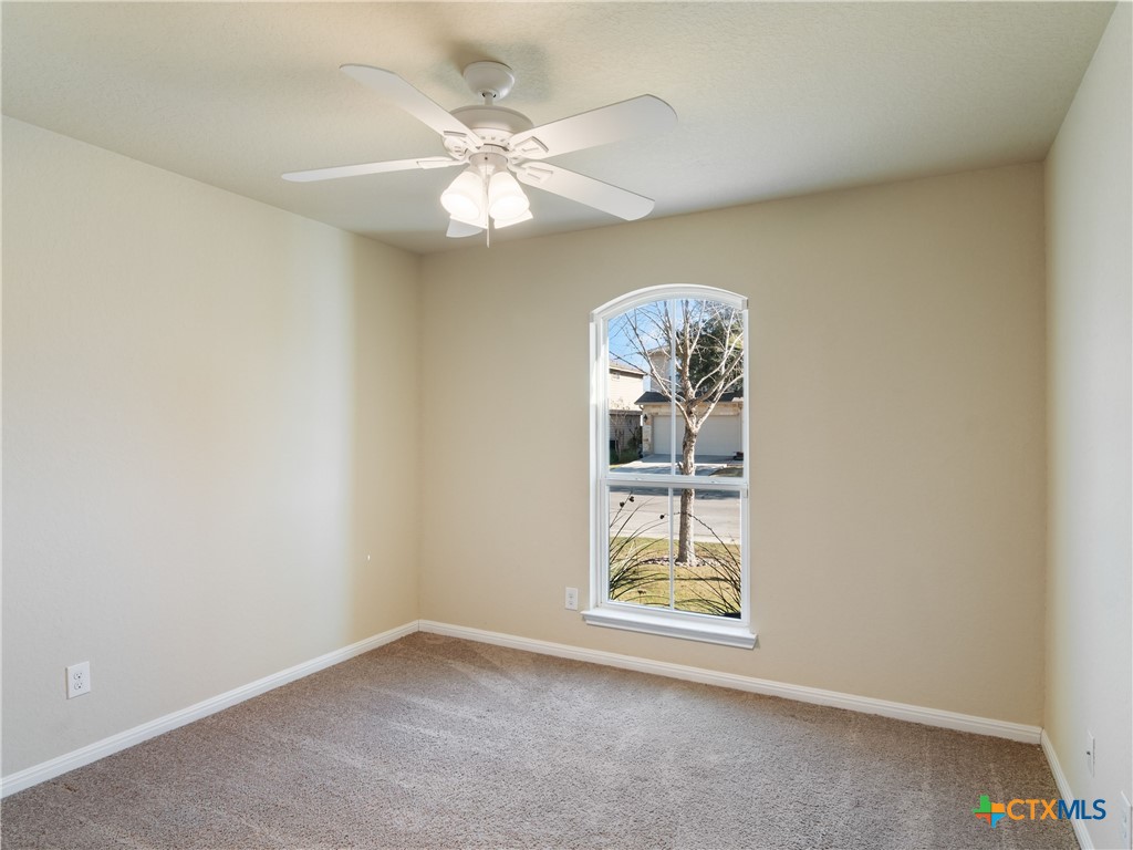 2231 Westover Loop New Braunfels, TX 78130 - Photo 9 of 35 an empty room with windows and fan