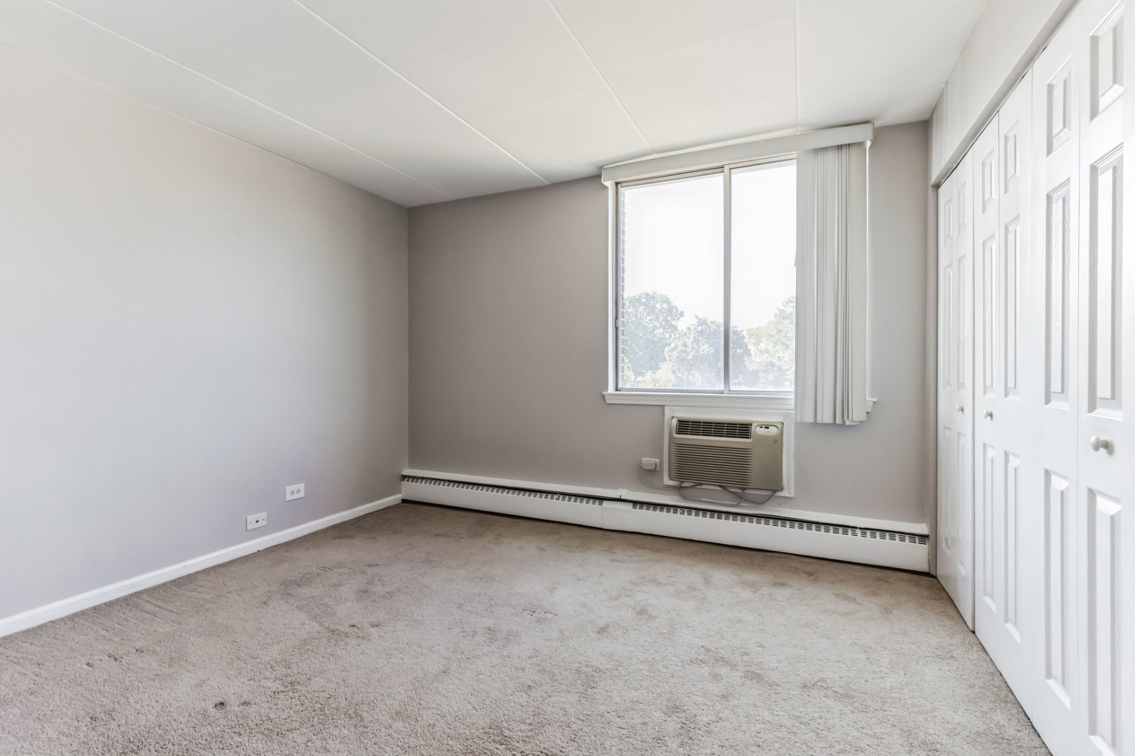 225 South Rohlwing Road, Unit 218 Palatine, IL 60074 - Photo 15 of 20 an empty room with windows