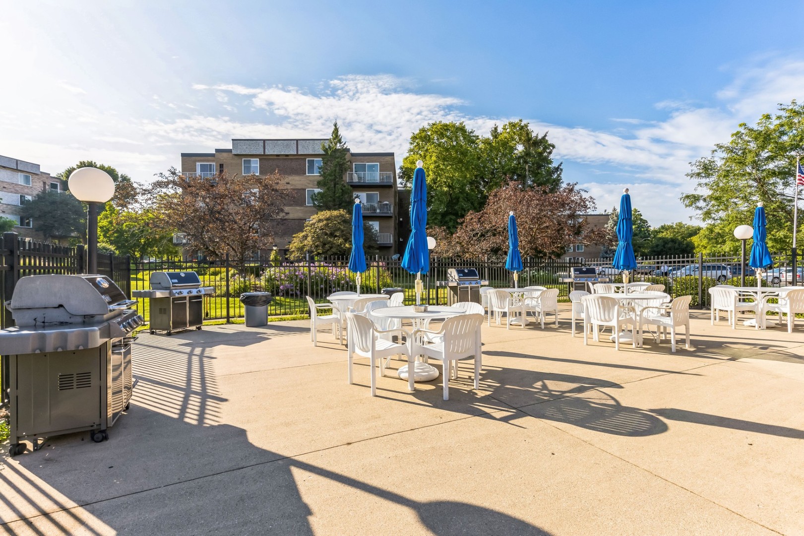 225 South Rohlwing Road, Unit 218 Palatine, IL 60074 - Photo 18 of 20 a view of a swimming pool with outdoor seating