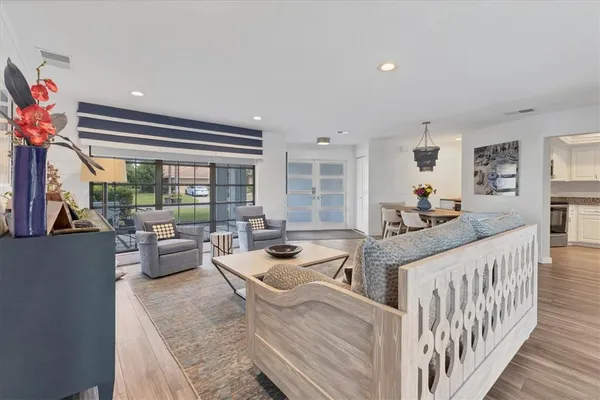 a kitchen with stainless steel appliances granite countertop a sink and cabinets
