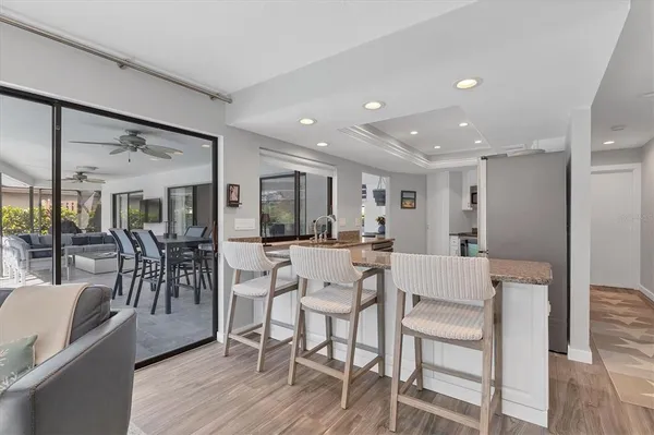 a kitchen with granite countertop a sink and a counter top space