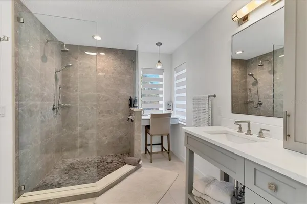 a view of swimming pool with seating area