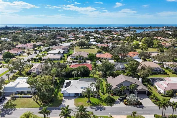 an aerial view of residential houses with outdoor space