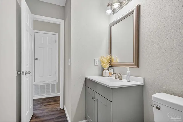 a bathroom with a sink vanity and a mirror
