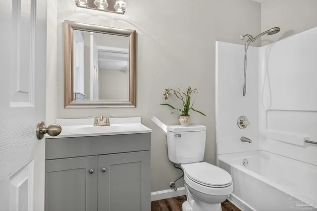 a bathroom with a sink toilet tub and shower