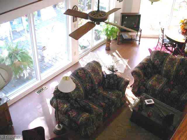 300 Grade Street Rural Hall, NC 27045 - Photo 3 of 7 Den/Family/Great Room. Greatroom has beautiful windows, vaulted ceilings and plenty of room for dining. Gas log fireplace stays.